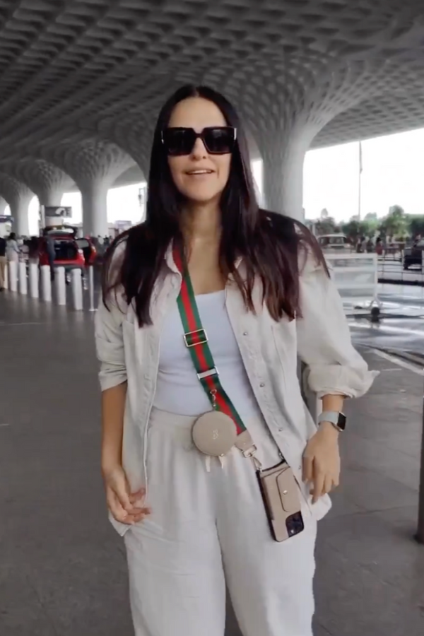 Neha Dhupia in Green and Red Canvas Strap with Round Pouch and Phone Case